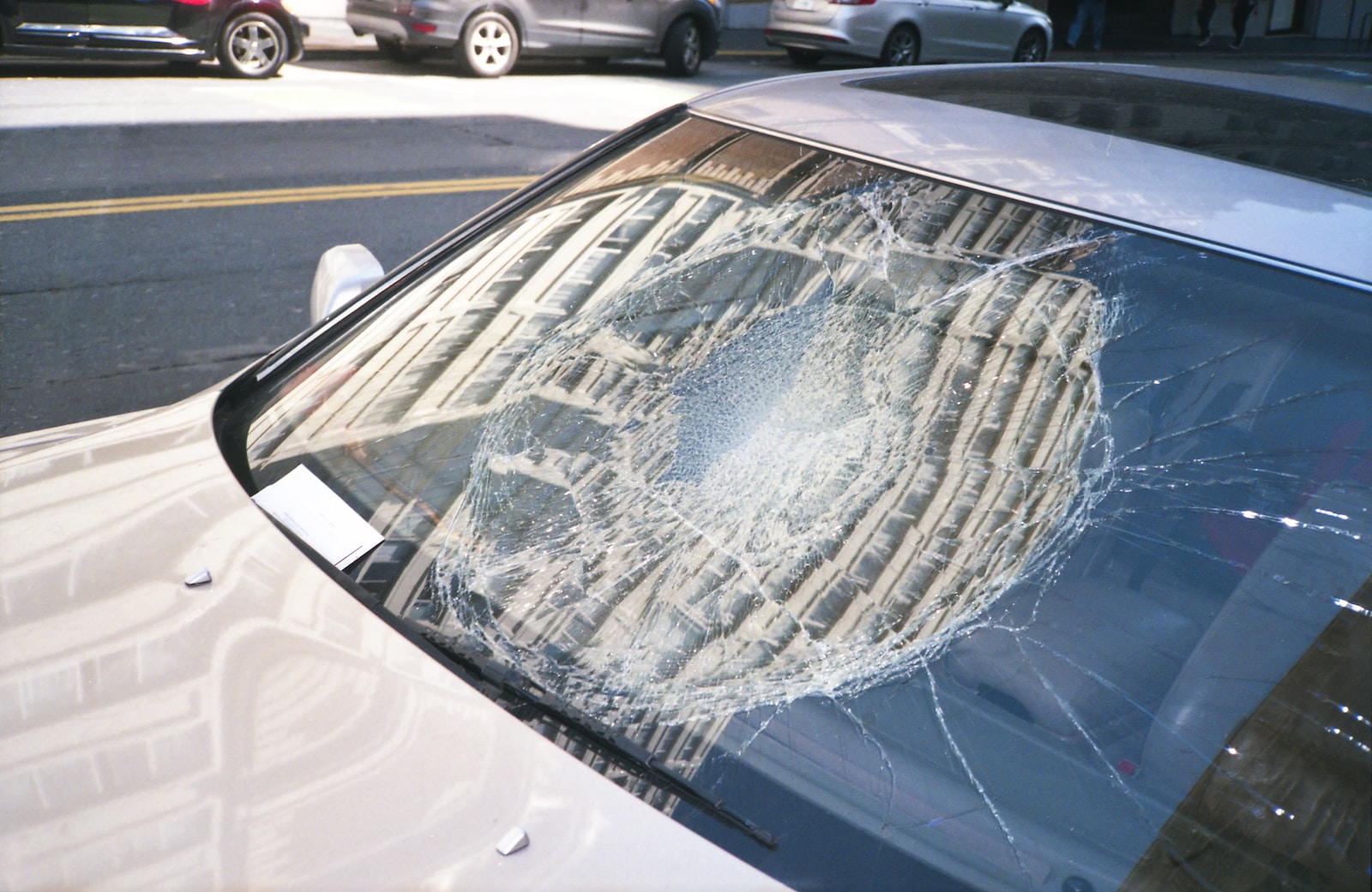 blue car with white snow on top Car accident due to falling object